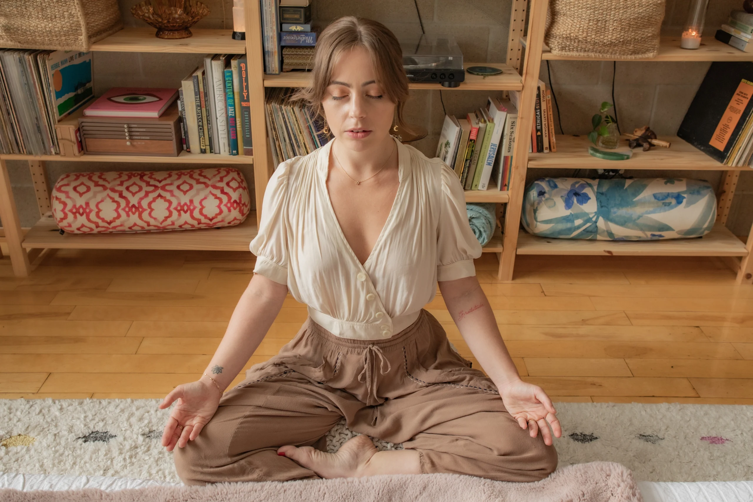 A client in calm seated meditation during a reiki session at the Word of Mouth healing loft in Los Angeles